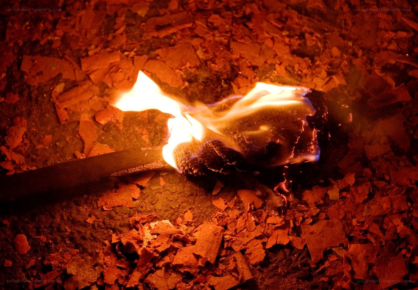 burning match on embers