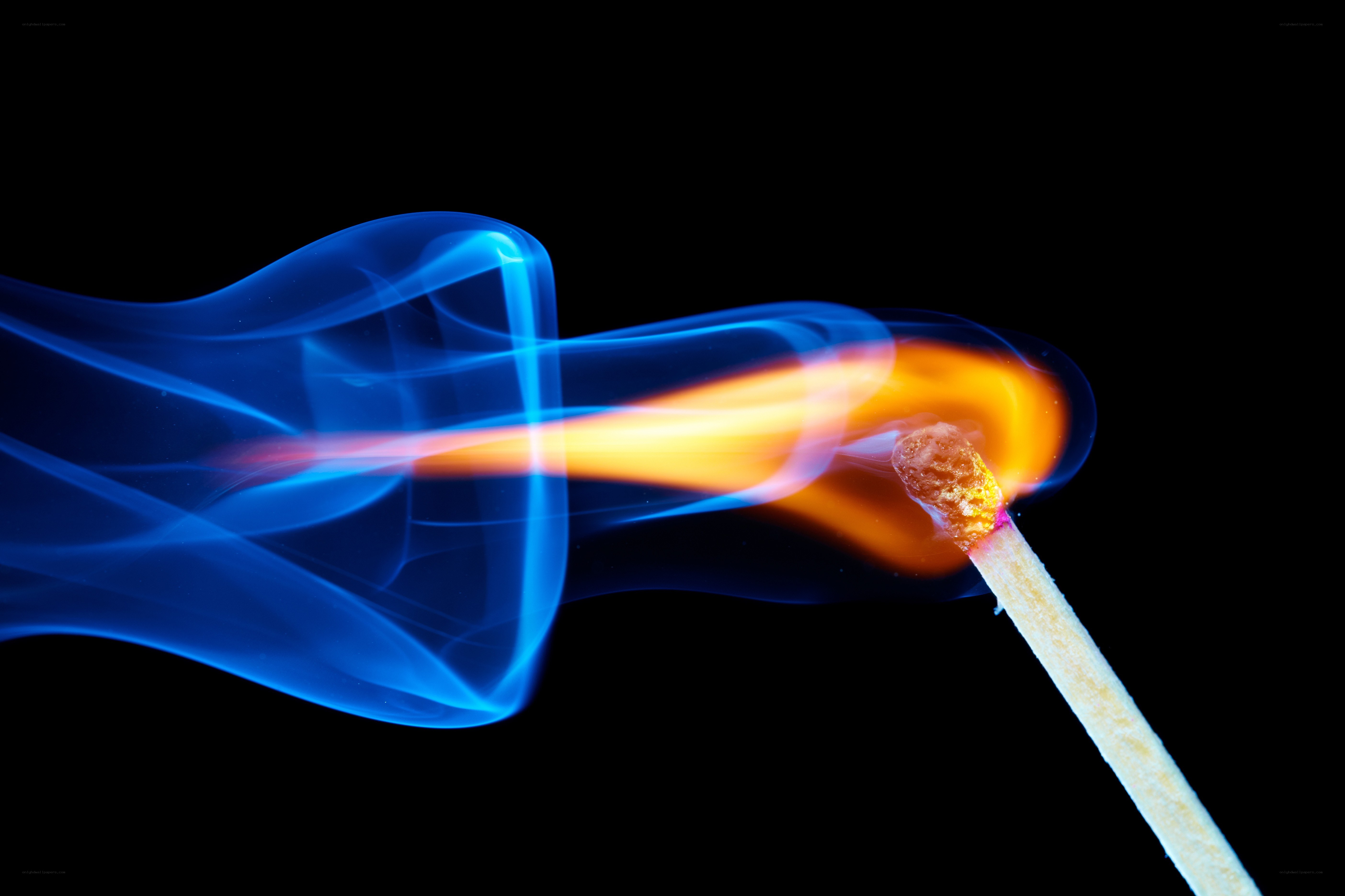 Burning match with blue smoke