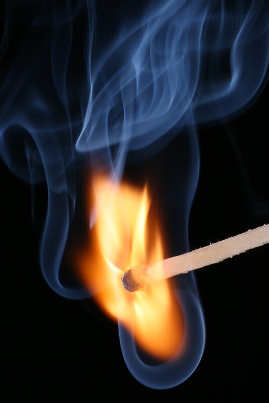 Burning match with smoke
