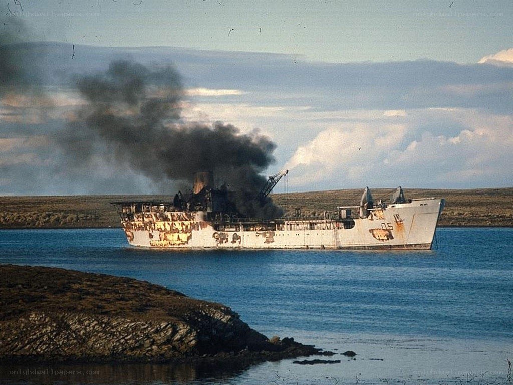 Burning ship in a bay