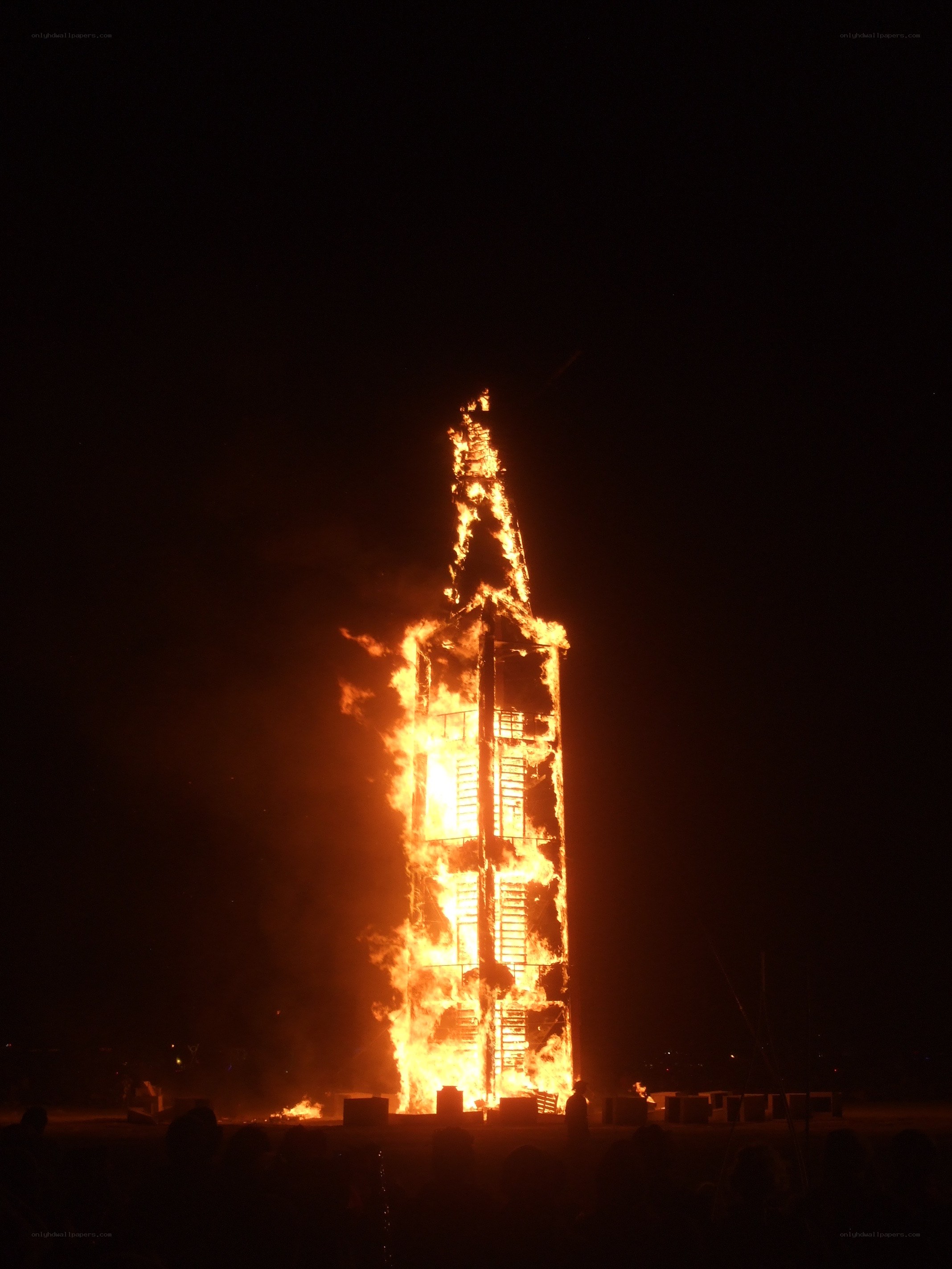 Burning tower at night