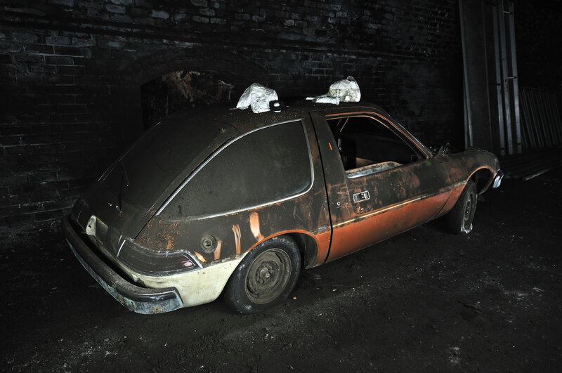 Burnt car in abandoned building