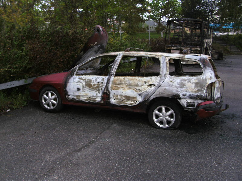 Burnt Car in Parking Lot