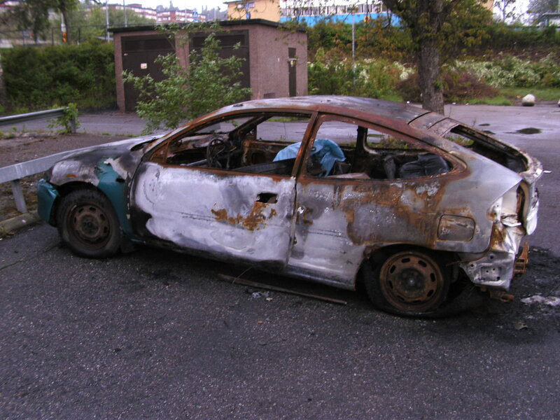 Burnt Car on Pavement