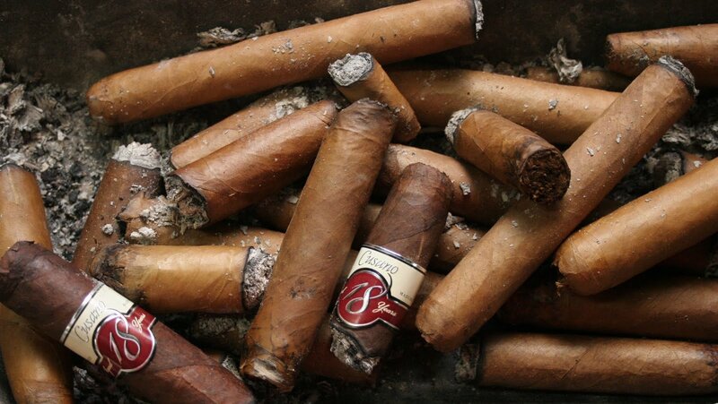 burnt cigars in ashtray