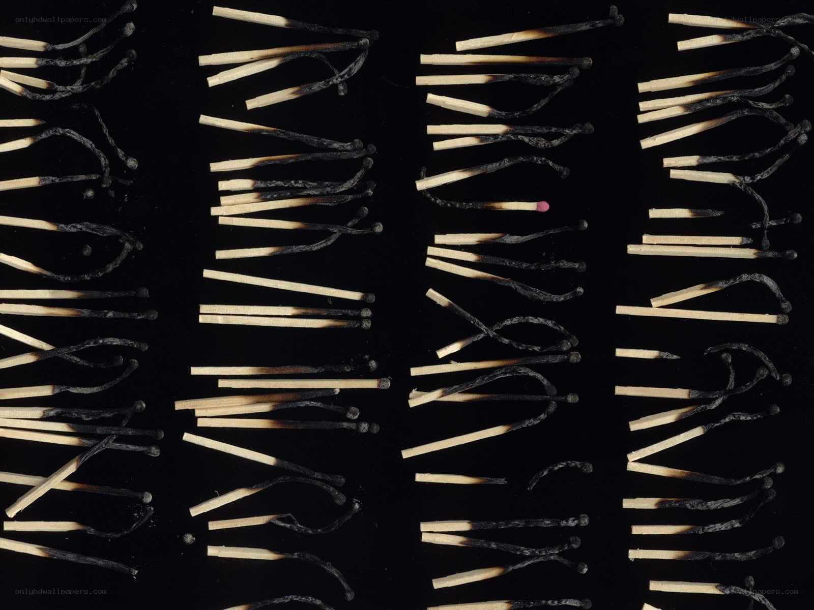Burnt matches on black background