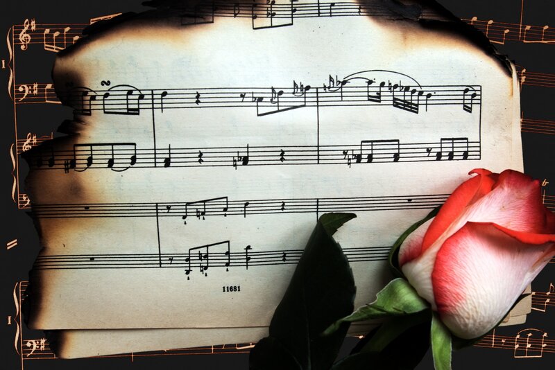 Burnt Sheet Music with Rose