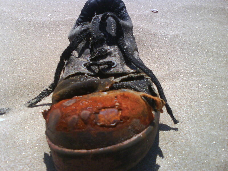 Burnt Shoe on Sand