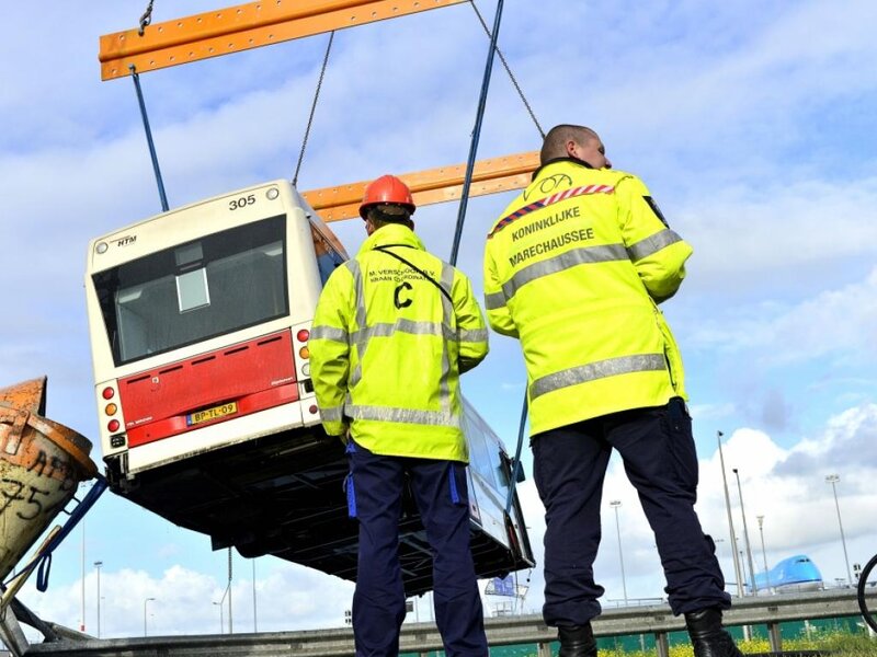 Bus Being Lifted by Crane
