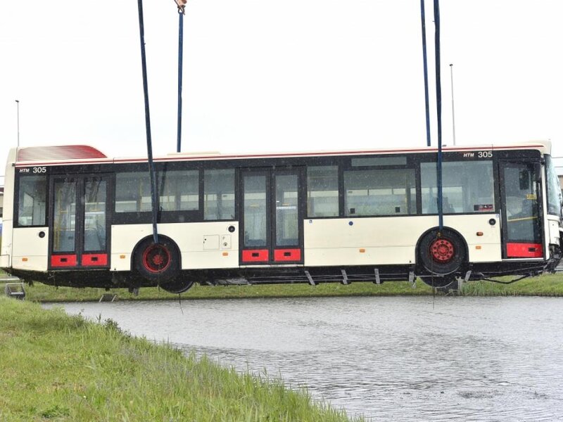 Bus Being Lifted by Crane — White