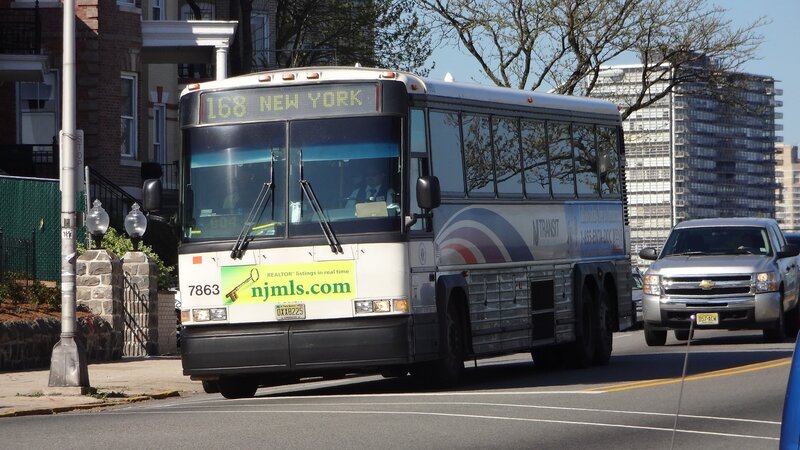 Bus on City Street — White