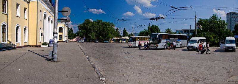 Bus station with passengers