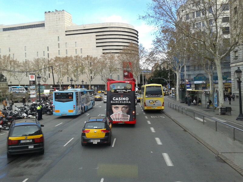 Buses and Cars on Street