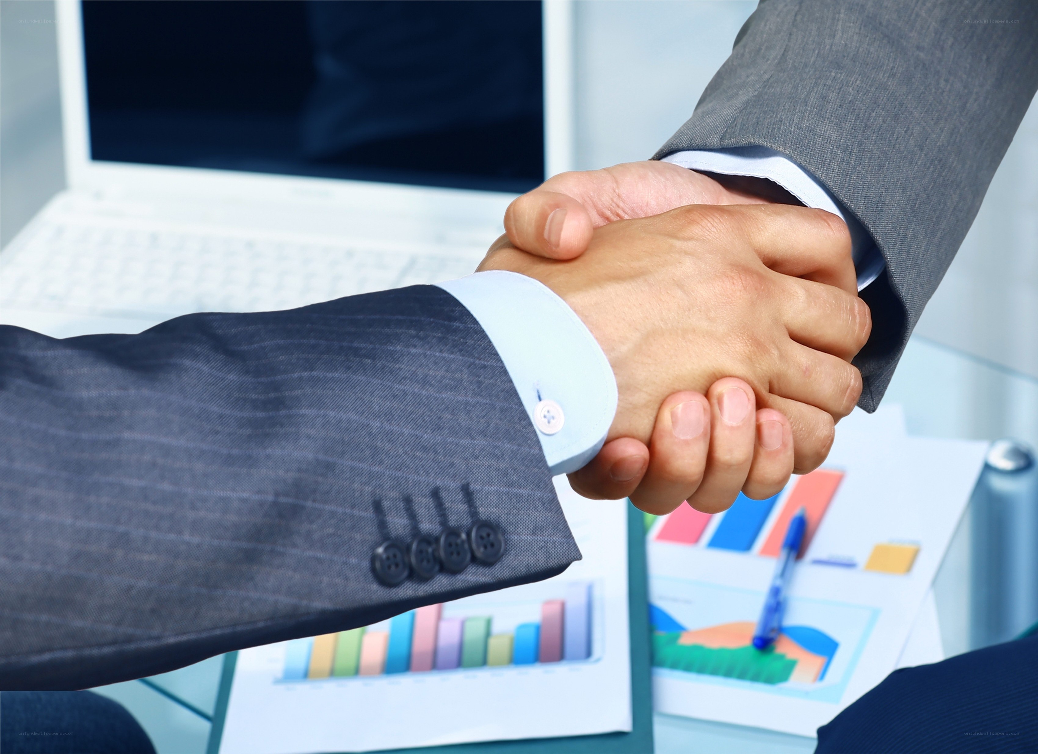 business handshake in office