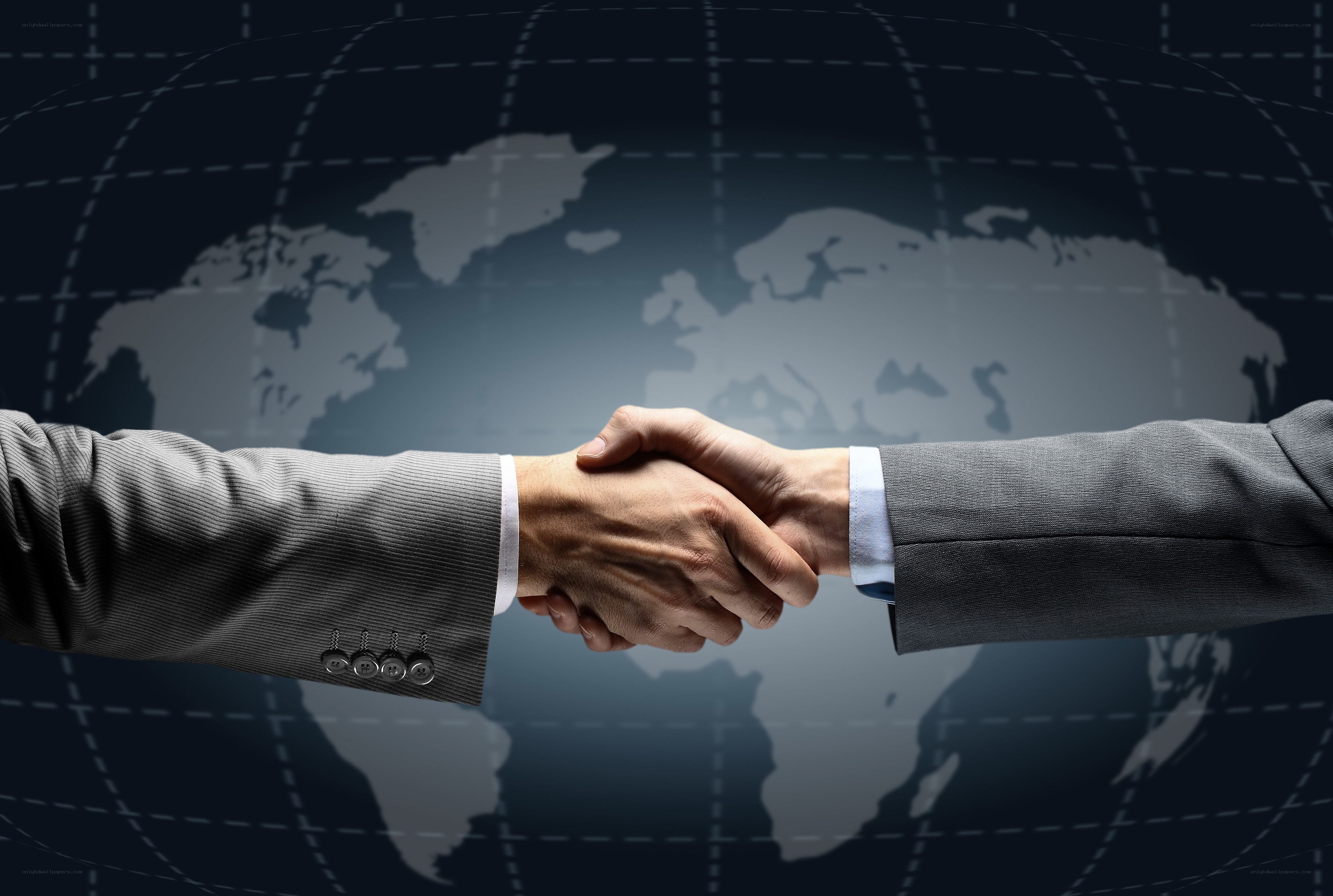 business handshake over world map