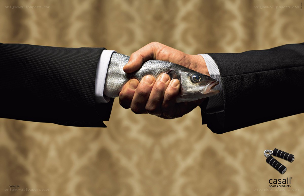 Business handshake with fish