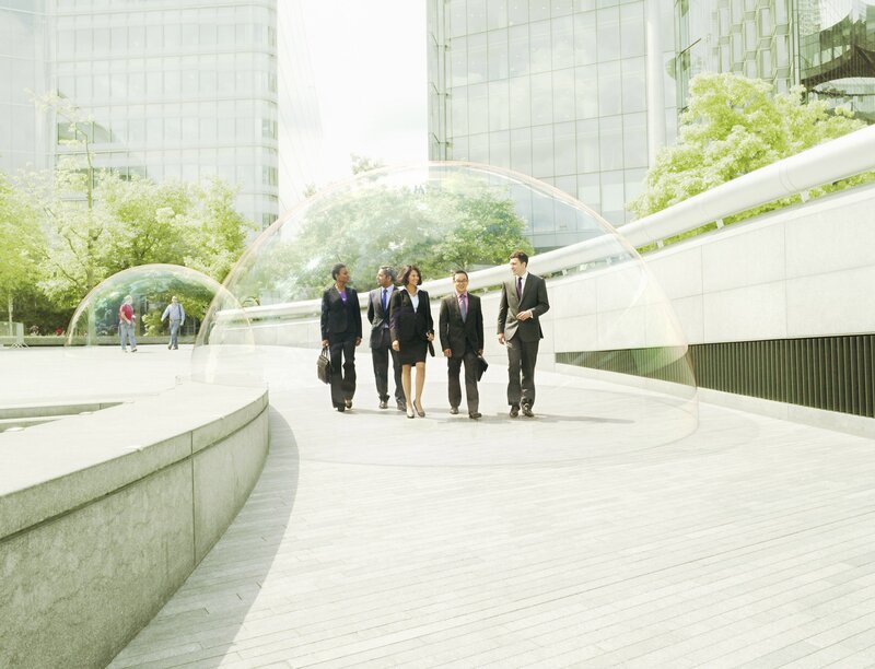 Business people walking in a modern plaza