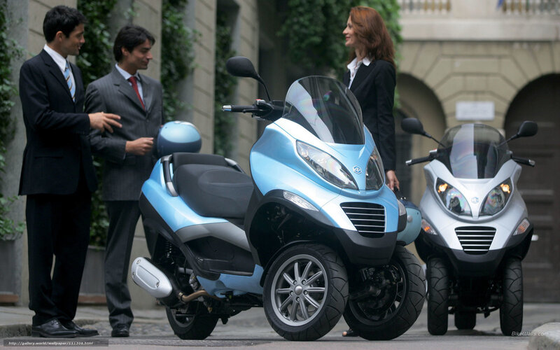 Business people with scooters