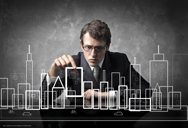 Businessman designing city skyline