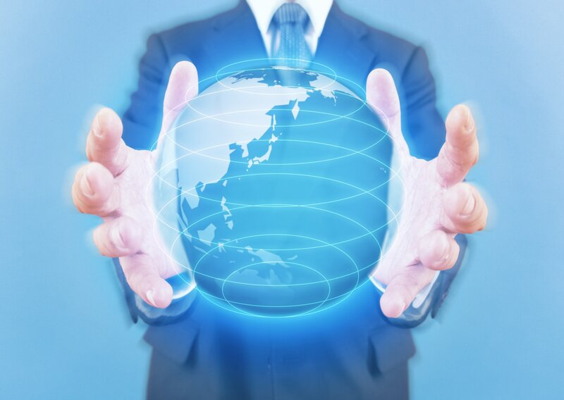 Businessman Holding Globe