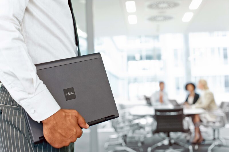 Businessman holding laptop