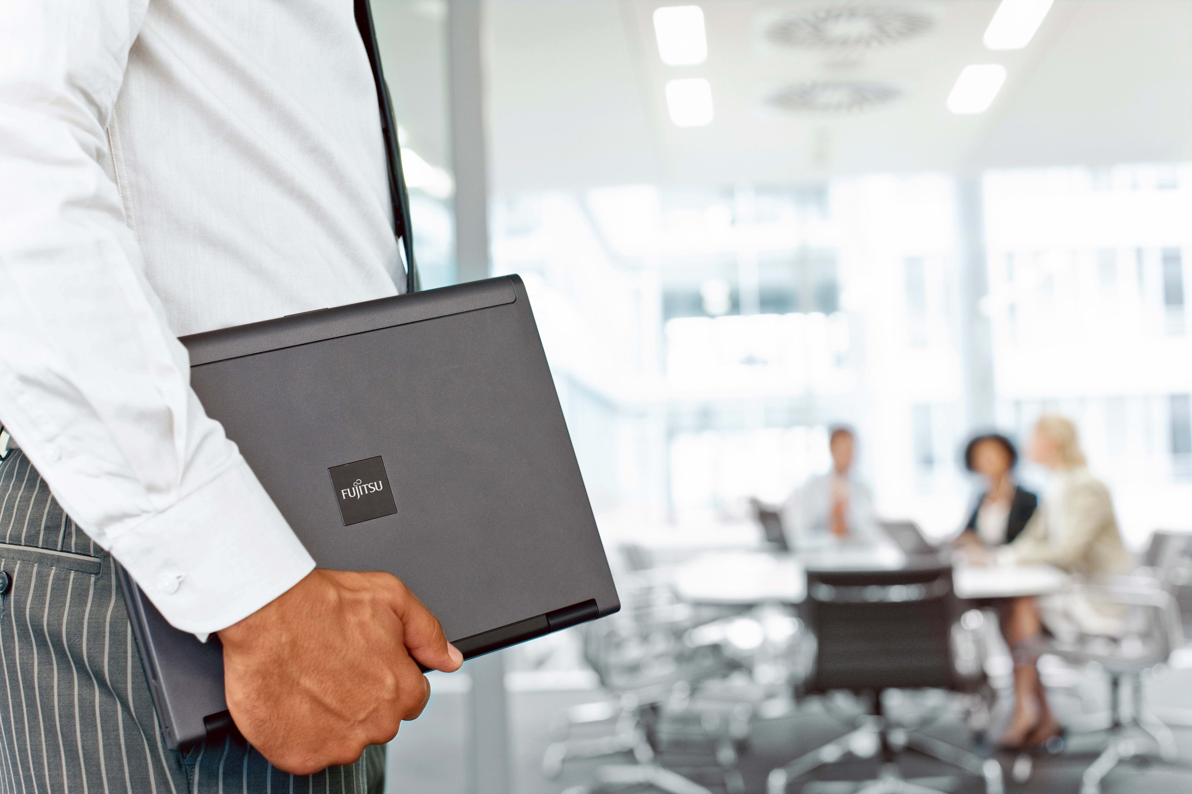 Businessman holding laptop