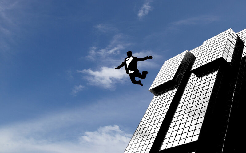 businessman jumping from building