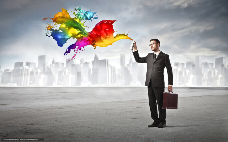 Businessman with colorful paint spray