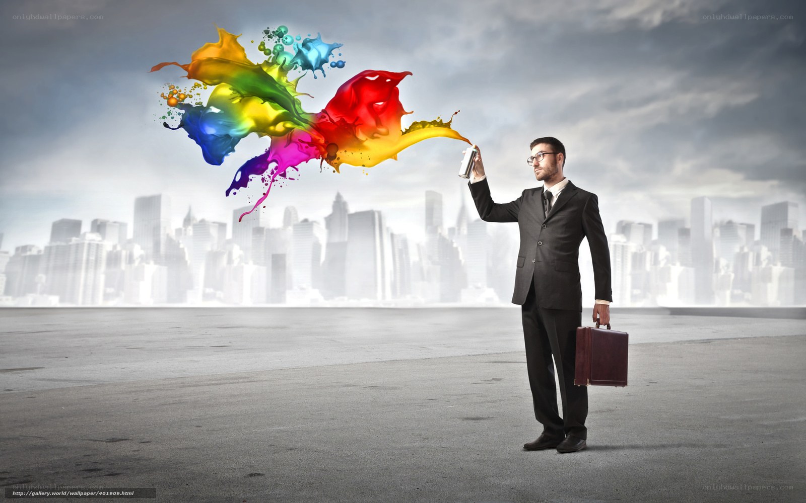 Businessman with colorful paint spray