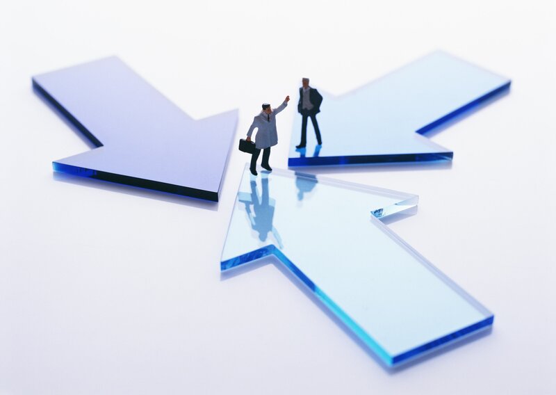 businessmen on arrow paths