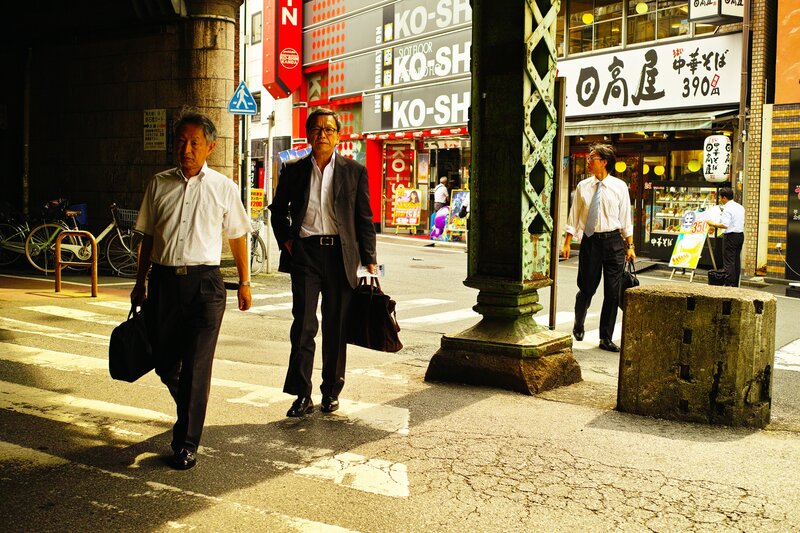 Businessmen walking on a city street