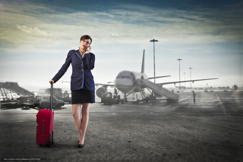 Businesswoman at airport with luggage