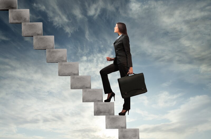 Businesswoman climbing stairs