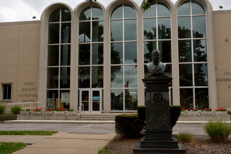 Bust Statue in Front of Building