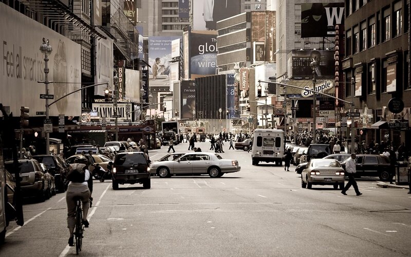 Busy city street with billboards