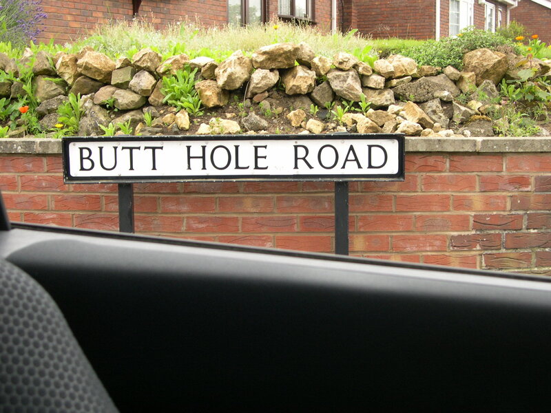 Butt Hole Road sign