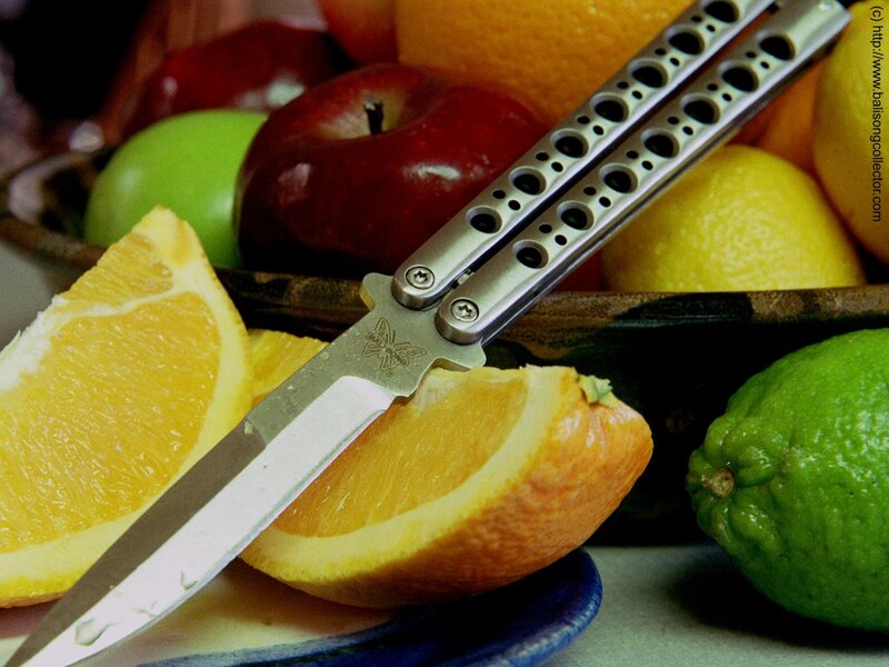 butterfly knife with citrus fruits