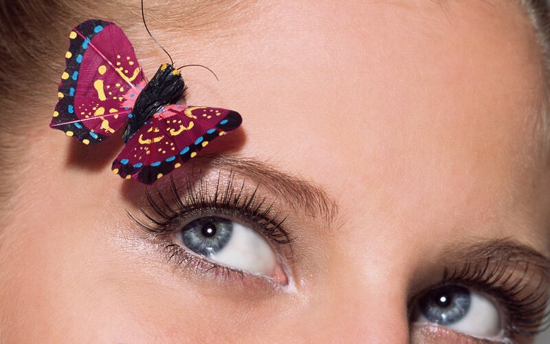 butterfly on woman's face