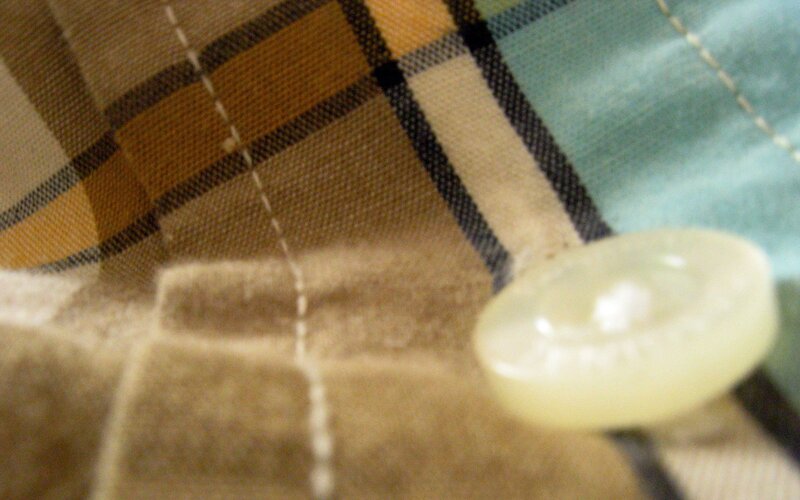 button on plaid fabric