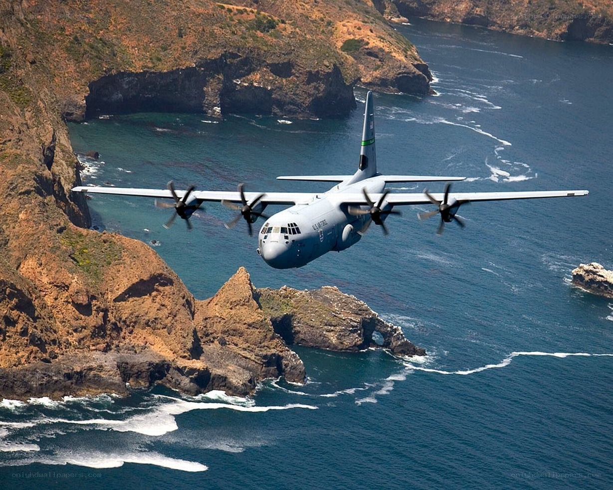 C-130 Hercules over coastal cliffs