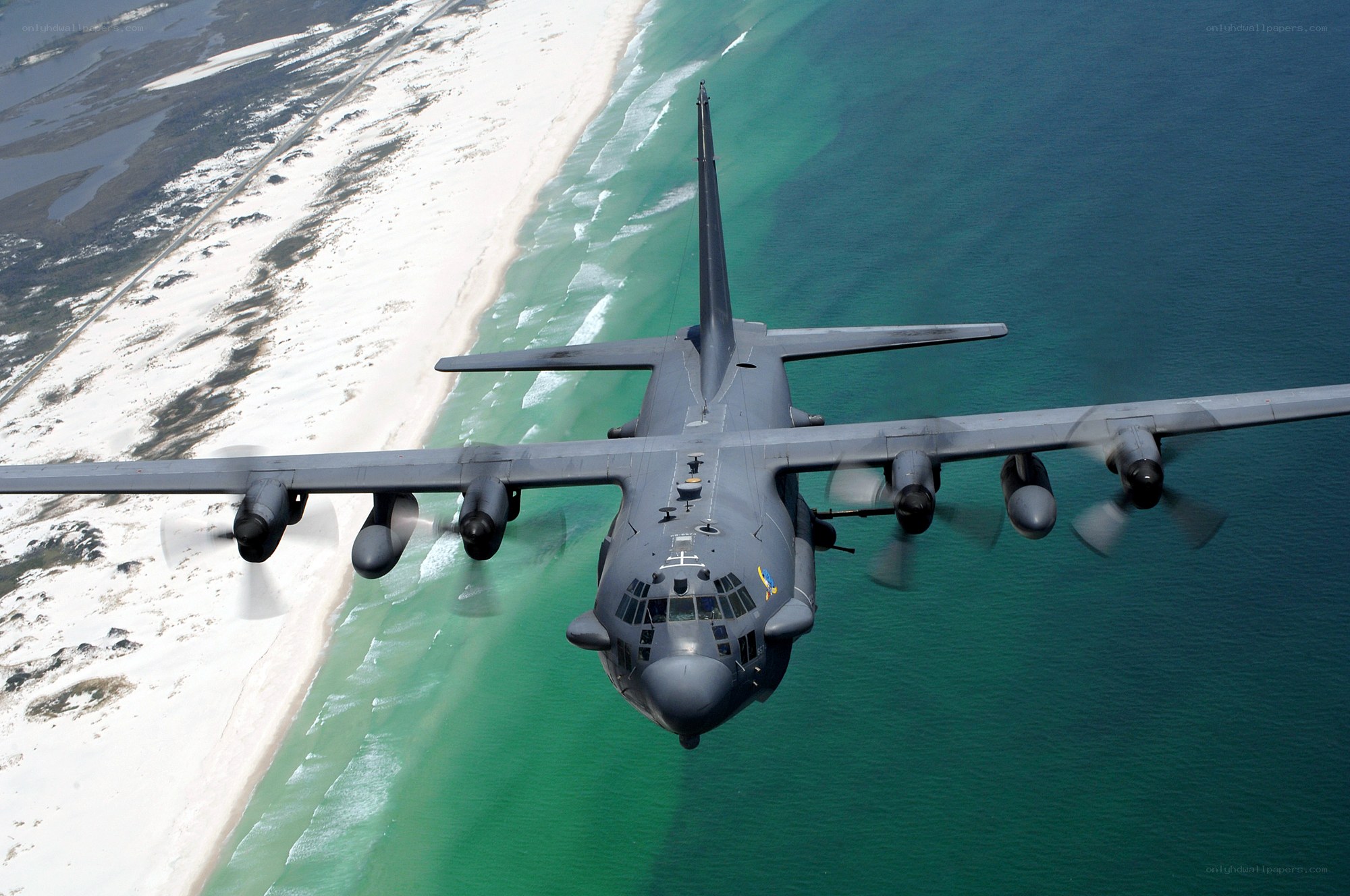 C-130 Hercules over coastline