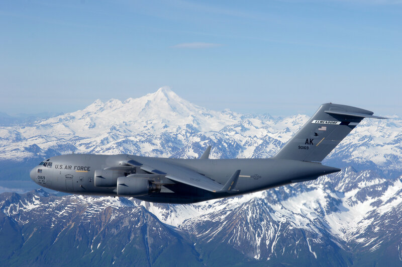 C-17 over snow-capped mountains