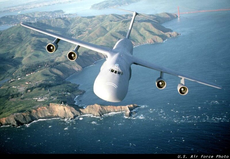 C-5 Galaxy over coastal landscape