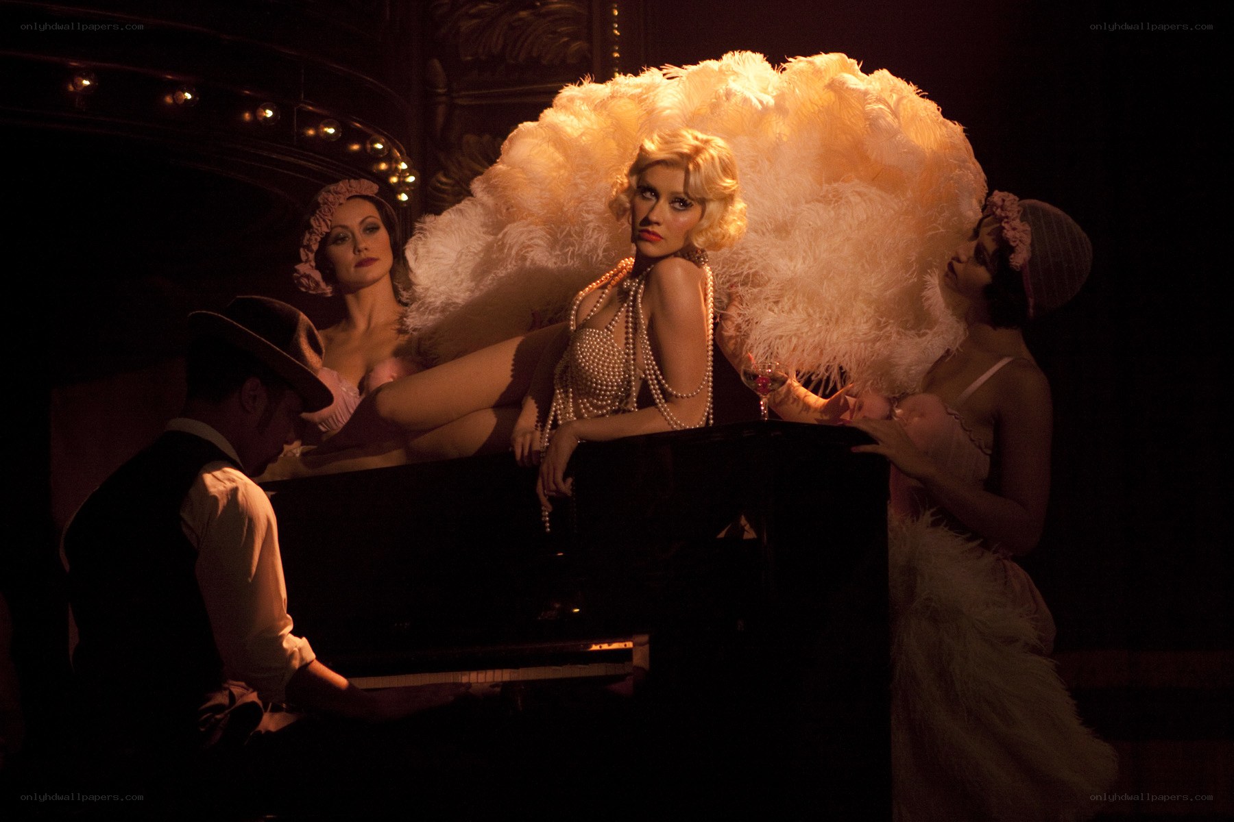 Cabaret performers with feathered hats
