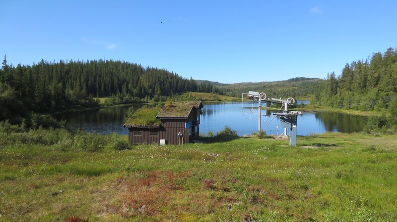 Cabin by a lake with ski lift