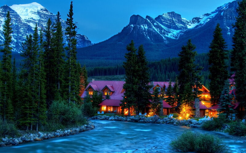 Cabin by River at Night