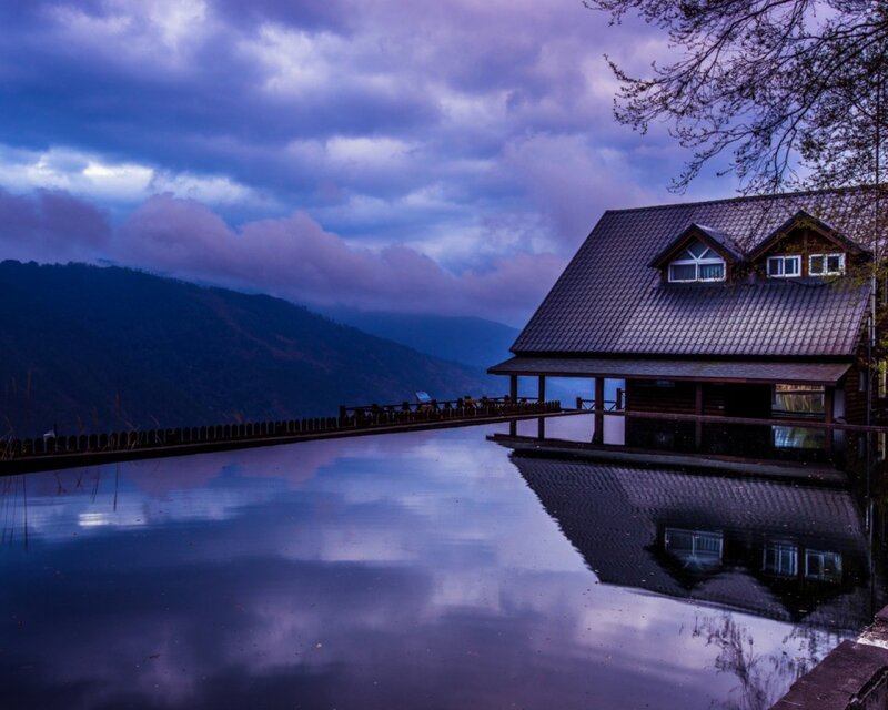 Cabin by the lake at dusk