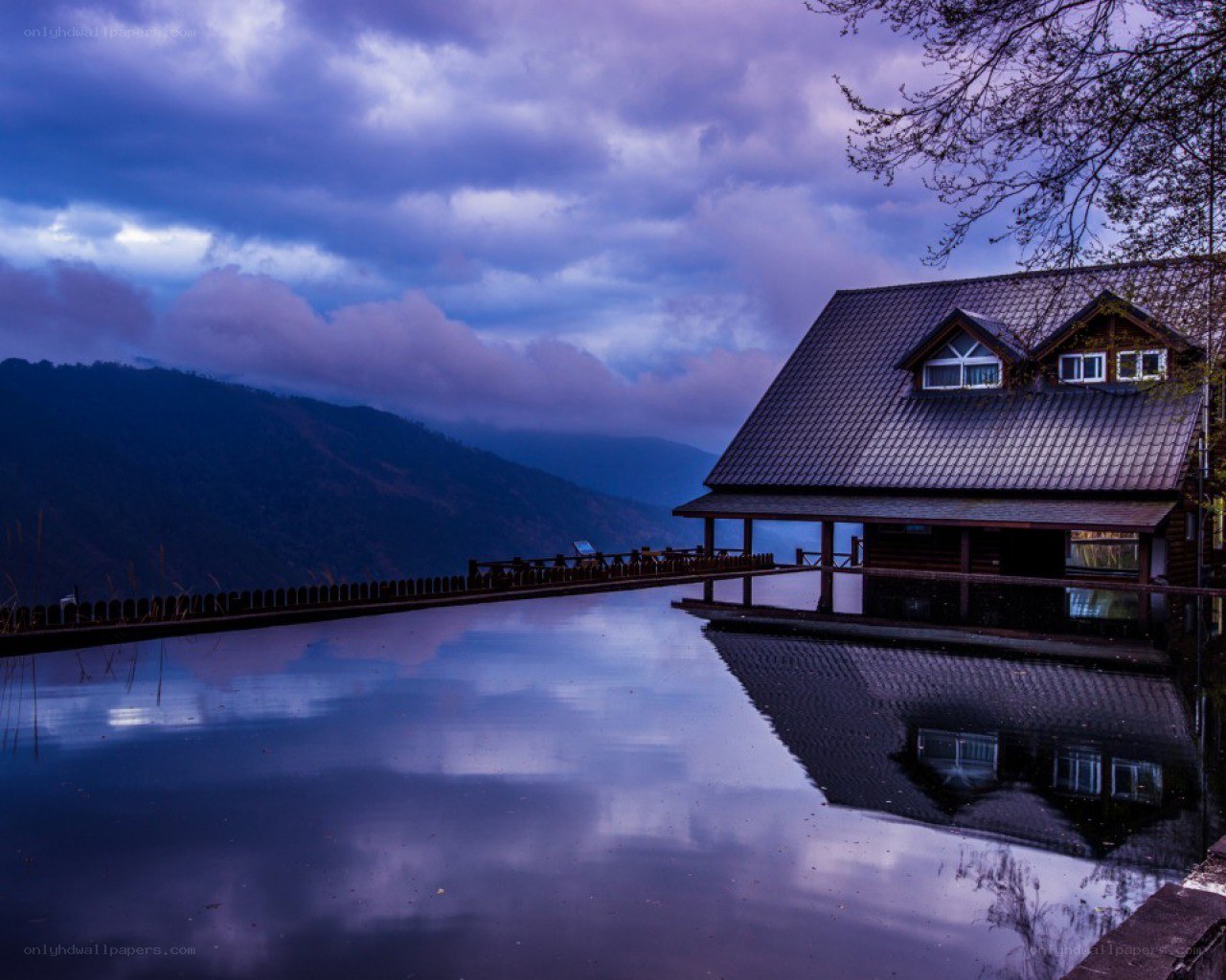 Cabin by the lake at dusk