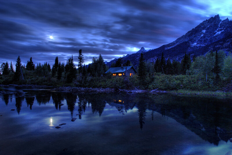 Cabin by the lake at night