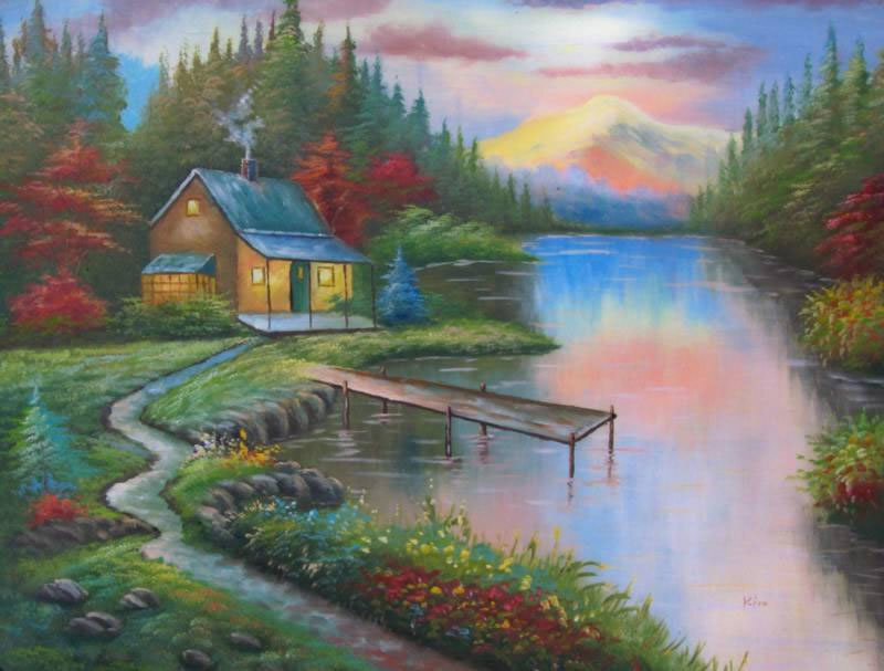 Cabin by the lake at sunset